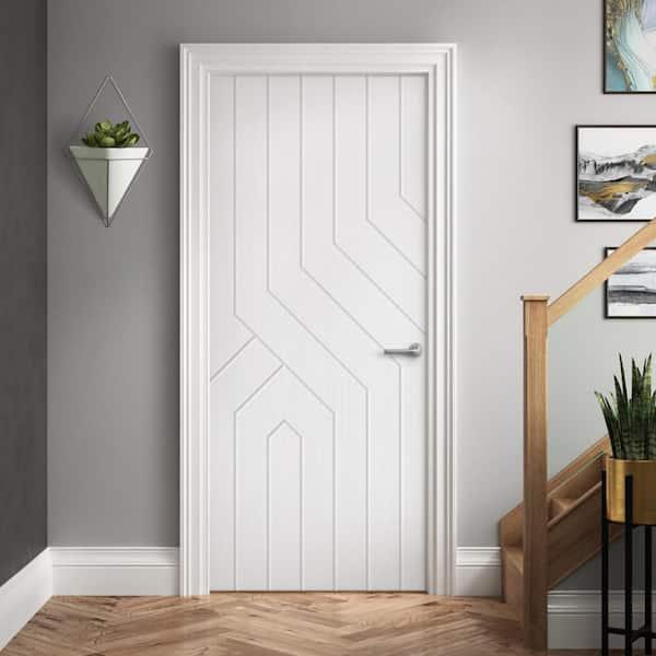 White Euro-Style Mdf Interior Door Featuring Symmetrical Angular Routed Grooves And Vertical Lines Beside A Modern Staircase.